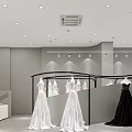 Wedding Dress Shop Interior With White Wedding Dresses Black Gown And Modern Lighting