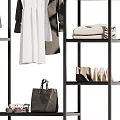 Clothing Rack Displaying Various Clothes Bags And Shoes