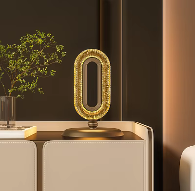 Golden Oval Table Lamp With Beaded Trim On Beige Cabinet Near Green Plants 3d model