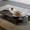 Modern Coffee Table With Black Wood Glass Top Gold Metal Legs Decorative Bowl And Magazines