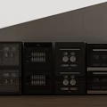 Black Kitchen Appliances with Transparent Doors Side by Side Featuring Interior Racks and Dishes