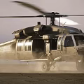 Military Helicopter Taking Off From Dusty Ground With Rotors Spinning