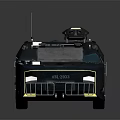 Dark Colored Armored Military Vehicle With Roof Mounted Equipment And Body Insignia