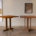 Two Wooden Dining Tables In Room With Neutral Wall Decorative Painting And Herringbone Wood Floor