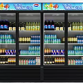 Two Glass Door Beverage Display Refrigerators Stocked with Bottled and Canned Drinks and LED Screens