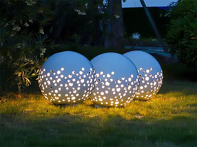 Illuminated White Spherical Outdoor Lights With Perforated Dot Design On Garden Grass 3d model