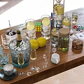 Refreshing Assorted Beverages with Glasses Ice Cubes Lemon Slices Coffee Cookies on Wooden Table