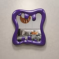 Stylish Purple Irregular Shaped Mirror in Bedroom with Bed Pillows and Copper Decor
