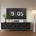 Black TV Stand With Carved Drawers Green Plant Clock Radio And White Floor Lamp