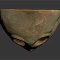 Ancient Clay Mask Featuring Prominent Eye Holes And Primitive Facial Design