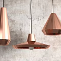 Three Copper Conical And Polygonal Pendant Lights Hanging On Textured Gray Wall