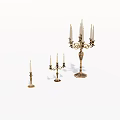 Set of Three Ornate Metal Candleholders With Various Heights And Decorative Details