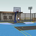 Outdoor Basketball Court With Surrounding Fencing And Adjacent Building Structure