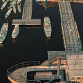 Scenic Harbor View With Moored Boats Wooden Piers And Calm Water Surface