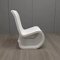 White Modern Leisure Chair With Sleek Lines In Interior Gray Walls Wooden Floor