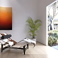 Modern Chaise Lounge In Bright Indoor Room With Orange Painting Potted Plant And Garden View