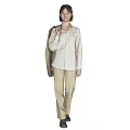 Woman Wearing White Shirt Beige Pants With Coat Draped Over Shoulder Front And Back View