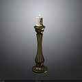 Elegant Golden Candlestick With Lit Candle And Slender Decorative Design