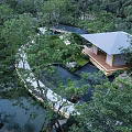 Tranquil Garden Landscape With Lush Trees Winding Path Water Pond And Wooden Pavilion