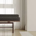 Black Sofa Bench With Wooden Legs On Herringbone Wooden Floor And White Curtains By Window