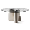Modern Round Dining Table With Glass Top And Sculptural Base Design For Contemporary Spaces