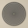 Circular Wall Decor with Gray Background and White Zigzag Radiating Patterns in Concentric Design