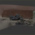 Classic Black Motorcycle Parked Against Red Brick Wall With Reflective Ground Surface