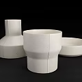 White Ceramic Bowl Plate Cup And Vase With Speckled Linear Design On Black Background