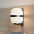 Stylish Modern Wall Lamp Featuring White Shade Black Horizontal Band On Wooden Wall