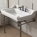 White Washbasin with Double Faucets on Metal Stand by Window and Wooden Floor in Bathroom