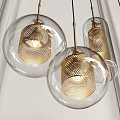 Modern Pendant Lights With Transparent Glass Shades And Brass Perforated Metal Details