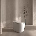 Modern White Toilet in Bathroom with Beige Wall Vase Dry Branches and Natural Light Shadows