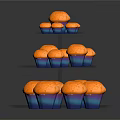 Three Tiered Transparent Glass Cupcake Stand Holding Multiple Orange Cupcakes