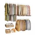 Various Stylish Clothes Hanging on Hangers with Knit Sweaters and Neutral Tones