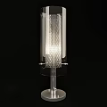 Modern Transparent Lighting Fixture With Perforated Design And Metal Stand Illuminating Space