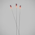 Three Slim Floor Lamps With Red Lampshades Lit In Grey Background