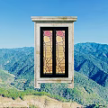 Carved Window with Stained Glass Design Against Blue Sky and Mountain View