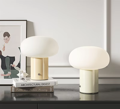 Modern White Dome Shade Table Lamps with Beige and White Bases on Stack of Books 3d model