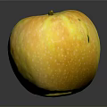 Fresh Yellow Apple With White Speckles And Stem On Shiny Black Surface