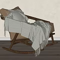Cozy Brown Rocking Chair with Wooden Frame and White Striped Fringe Blanket