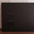 Modern Black Kitchen Cabinets With Built in Ovens Against Brick Wall And Wooden Floor