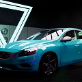 Blue Sedan With Modern Design Shiny Body And Sporty Wheels In Neon Lights Background