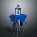 Elegant Decorative Lantern On Blue Patterned Tablecloth With Ornate Metal Legs