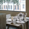 Spacious Bright Restaurant Interior With Large Windows Outside Trees And Neatly Arranged Tables Chairs