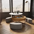 Elegant Round Coffee Table with Wooden Top Metal Base and Upholstered Stools in Bright Room