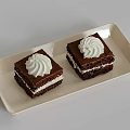Two Chocolate Cake Pieces on Light Rectangular Plate with Chocolate Layers and White Cream Topping 3d model