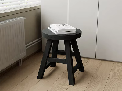 Black Round Side Table with Three Legs and Books on Wooden Floor Near White Cabinets 3d model