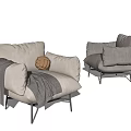 Light Colored Single Seater Sofa With Gray Blanket Woven Ball And Metal Legs