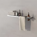 Neatly Folded White Towel On Bathroom Wall Mounted Shelf With Toiletries Bottles