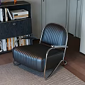 Black Leather Accent Chair With Metal Frame Striped Design On Rug And Bookshelf Wooden Floor